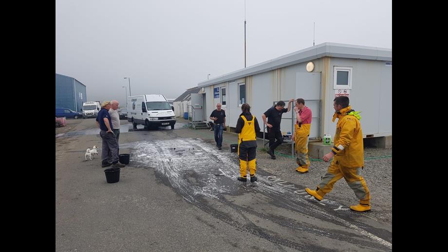 RNLI crew washing cars outside their station
