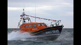 RNLB Stella and Humfrey Berkeley 13-25 at sea, with flags