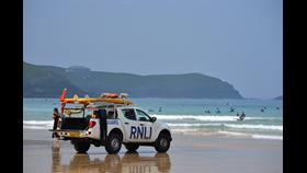 RNLI lifeguard patrol truck at Fistral