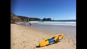 Rescue board on the beach at Porthcurno
