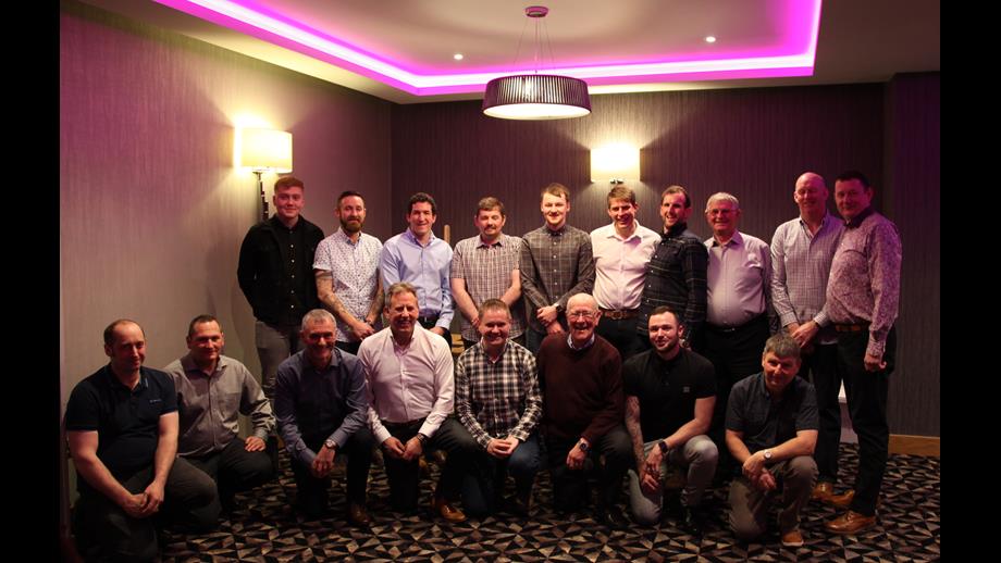 Members of Macduff Lifeboat Crew grouped in two rows, with the front row kneeling
