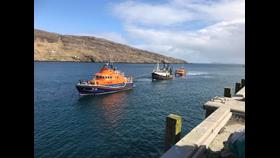 Stornoway Lifeboat tow fishing vessel with Leverburgh Lifeboat to the stern of the casualty vessel.