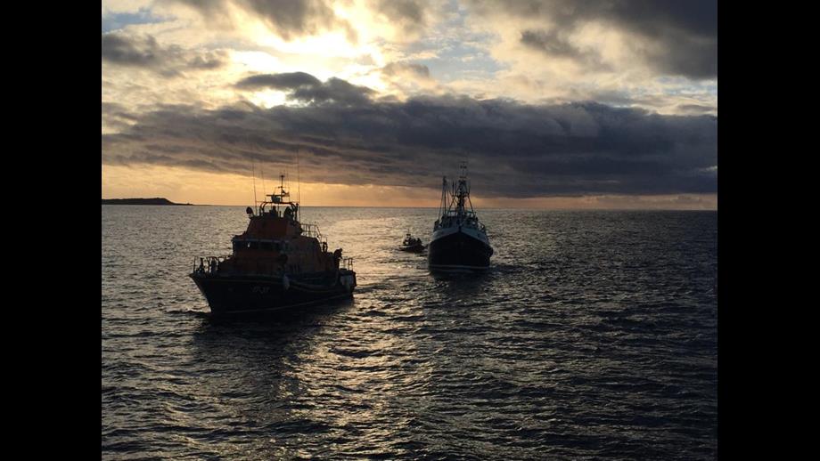 Buckie lifeboat towing Prosperity in to Macduff with Macduff lifeboat astern