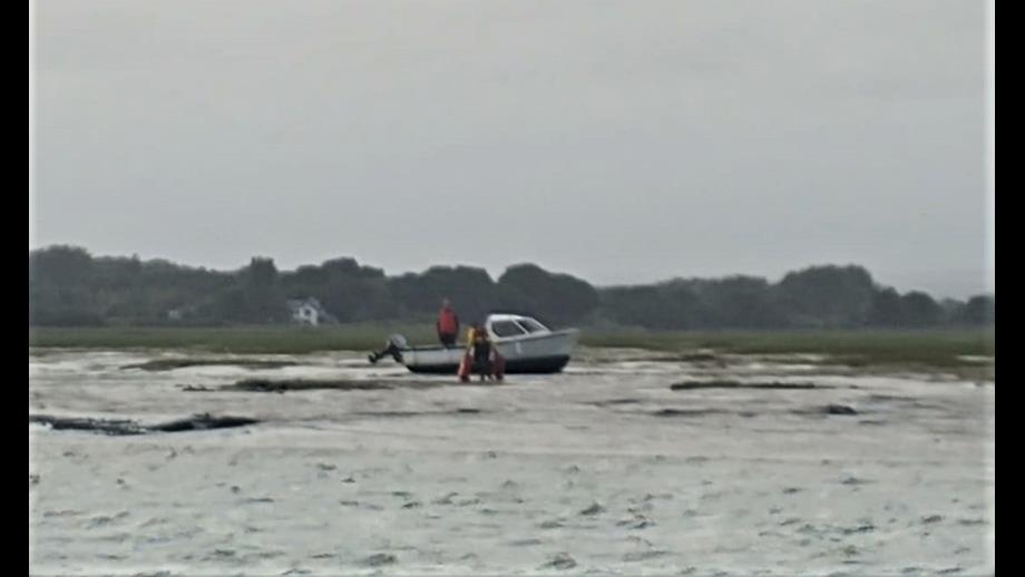 Shot of the vessel aground on the mud.