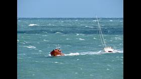 Photo of the Hayling Island RNLI Atlantic 85 lifeboat towing the yacht back into calmer waters.