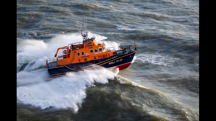 Yarmouth RNLI's Severn class lifeboat crashing through waves from above