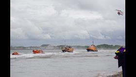 RNLI Lifeboats from Fleetwood's flank stations at Blackpool, Lytham and Barrow are joined by HM Coastguard helicopter in the Grand Parade.