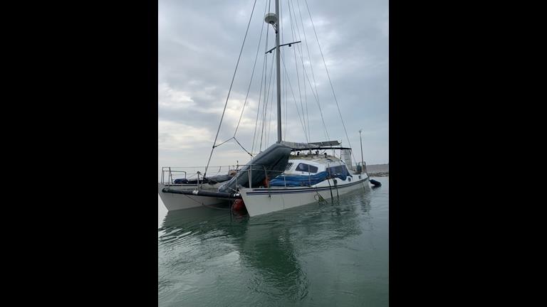 The casualty catamaan is seen from the port (left hand)side with it low in the water due to flooding