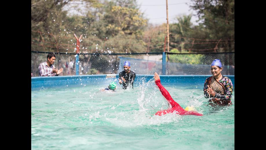 Children take part in survival swimming lessons in a portable pool in Cox’s Bazar, Bangladesh