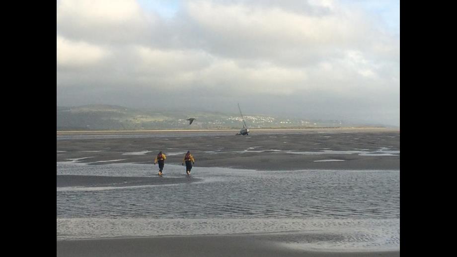 Cricceth RNLI Crew-member walking towards the yacht