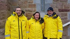 Siblings Cornelia and Dominic Lyne and their father in RNLI kit
