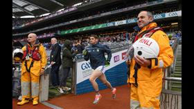 Killian Young emerges from Croke Park tunnel flanked by RNLI