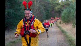 Photo of a crew member in kit taking part in a previous year's run.