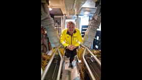 Greg McMurchy, standing in the engine room