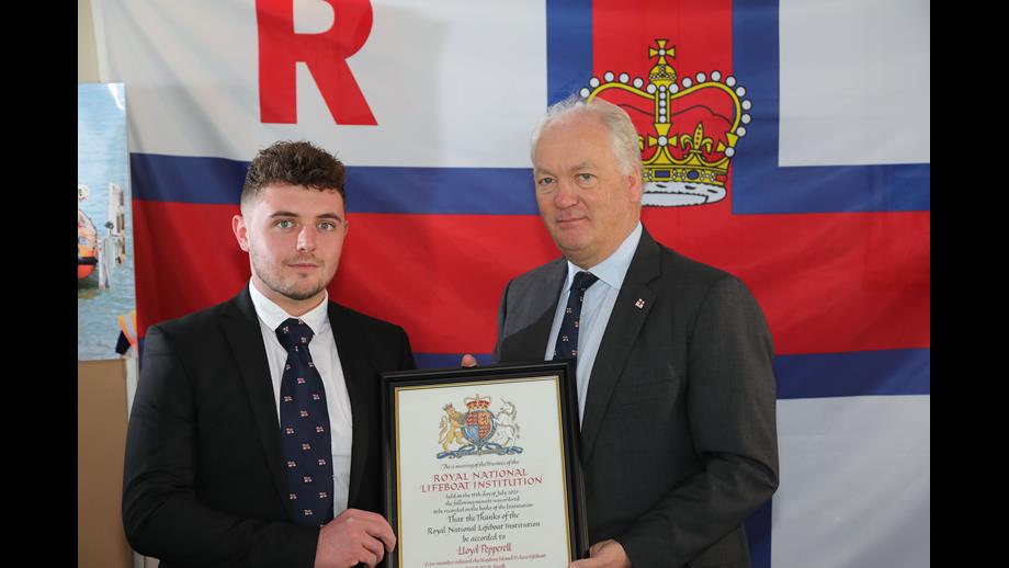 Volunteer crew member Lloyd Pepperell with Mark Dowie, Chief Executive of the RNLI.