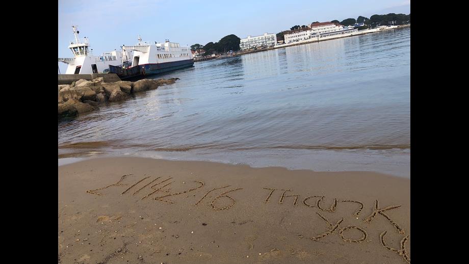 Message in the sand, with Ferry in the background