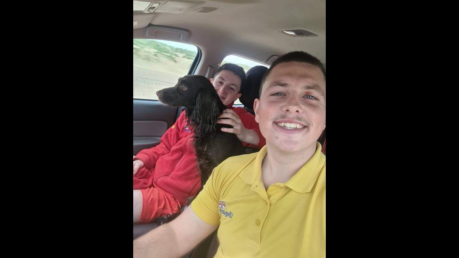 RNLI lifeguards Owain and Peter with dog Coco after the rescue