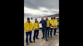CE Mark Dowie presents Arranmore RNLI with their award