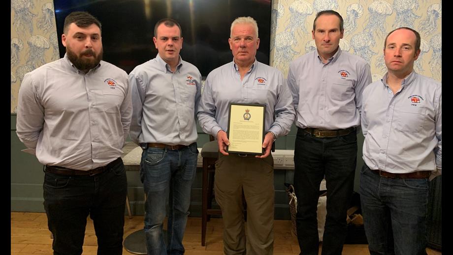 Coxswain and crew at Portrush RNLI with their CE Commendation
