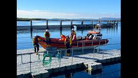 Lifeboat on versadock with helm and 3 crew