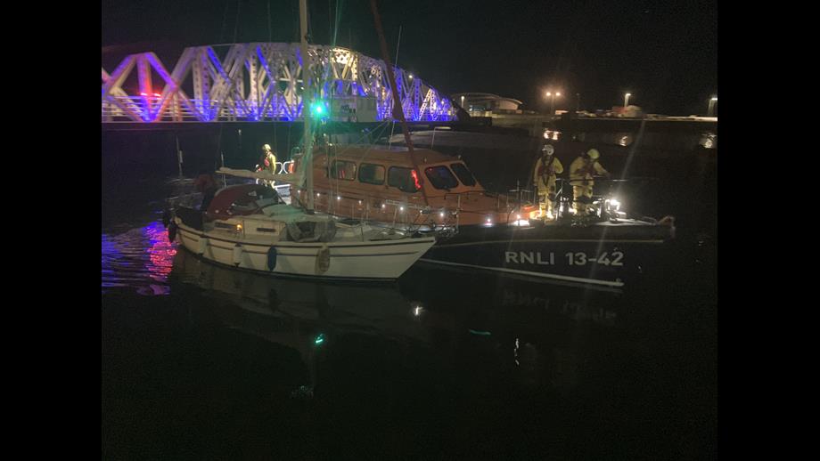 Ramsey Lifeboat Escorting Yacht into Ramsey Harbour
