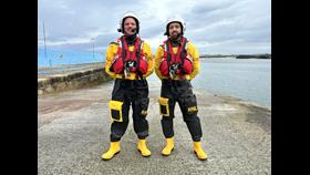 Brian Fowley and Chris Fox of Bundoran RNLI standing at the pier in Bundoran in the lifeboat crew kit.