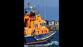 Holyhead's all-weather lifeboat Christopher Pearce heads out to rescue six people on Tuesday morning