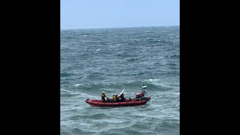 Image taken from the shore of rescue of a surfer at St Agnes