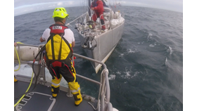 Crew member David Casey securing a towline 