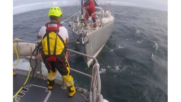 Crew member David Casey securing a towline 