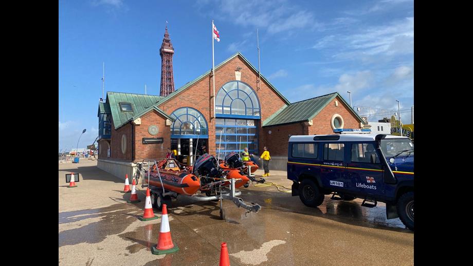 Lifeboats in front of Blackpool Lifeboat Station with the Tower