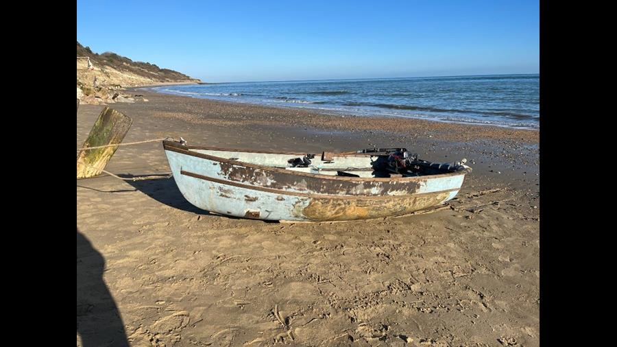 Picture of the open 12 foot dinghy ashore in Whitecliff Bay