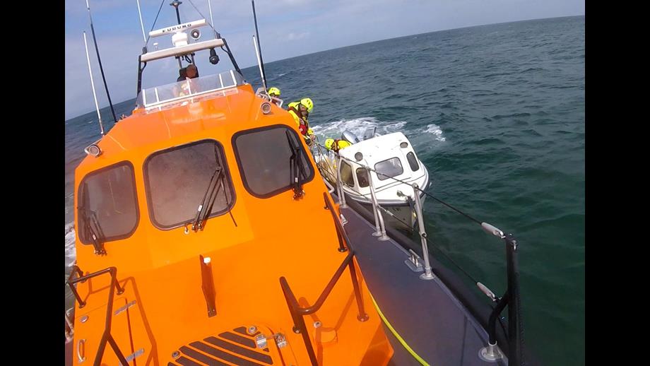 Clogherhead RNLI Shannon class lifeboat alongside the 19 ft. drifting leisure craft