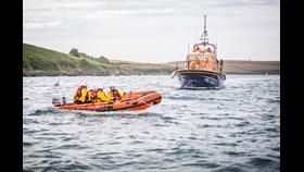Rock RNLI D Class awaiting the arrival of Padstow Lifeboat on the Camel Estuary.