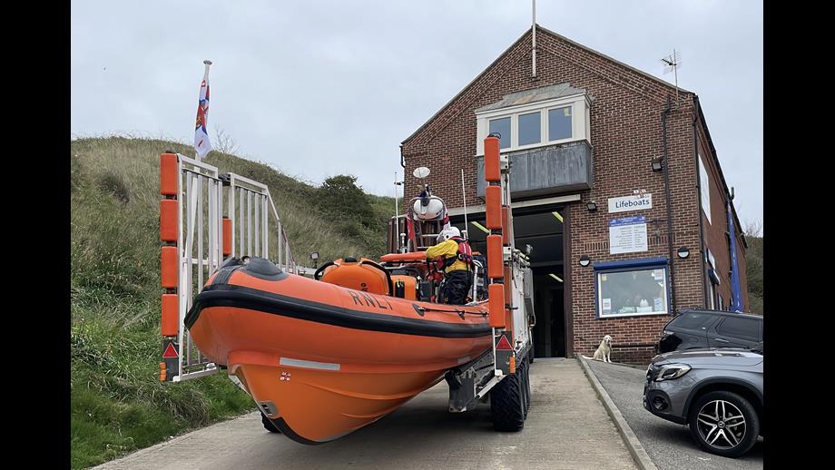 Trailer with Atlantic 85 lifeboat on the slipway at Flamborough RNLI station.