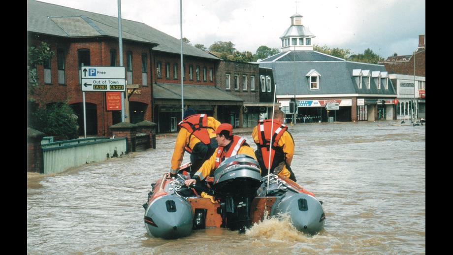 Simon Tugwell helming the inshore lifeboat in flooded Uckfield High Street in 2000