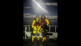 Two female volunteer lifeboat crew members