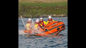 D class lifeboat with four volunteer crew on the Camel Estuary.