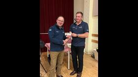 photo shows Jakes Scott Presenting Alan with his medal at the recent quiz night