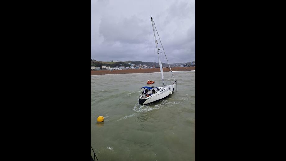 Lifeboat alongside the yacht with Hastings in the background