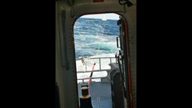 Taken from the stern showing the tow-line to the stricken fishing vessel.