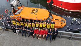'One Moment One Crew' at Eyemouth RNLI, volunteers in a group photo at Eyemouth's all-weather lifeboat