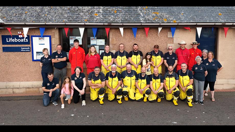 'One Moment One Crew' at Eyemouth RNLI, volunteers come together at Eyemouth lifeboat station for a group photo