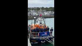 Lifeboat crew onboard boat