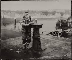 Man standing on harbourside