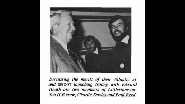 A black and white photo from the late 1970s of Charlie Davies meeting former Prime Minister Edward Heath on the RNLI stand at the London Boat Show