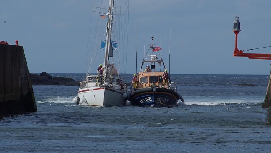 Eyemouth RNLI volunteers tow casualty yacht into Eyemouth harbour after the yacht had engine failure at the Hurkar rocks.