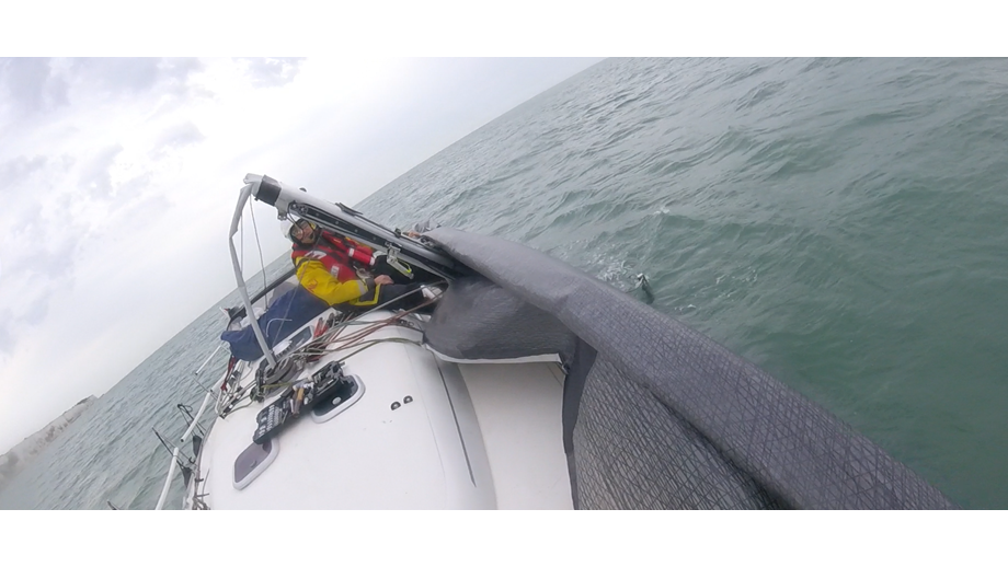 Walmer crew attempting to roll sail.