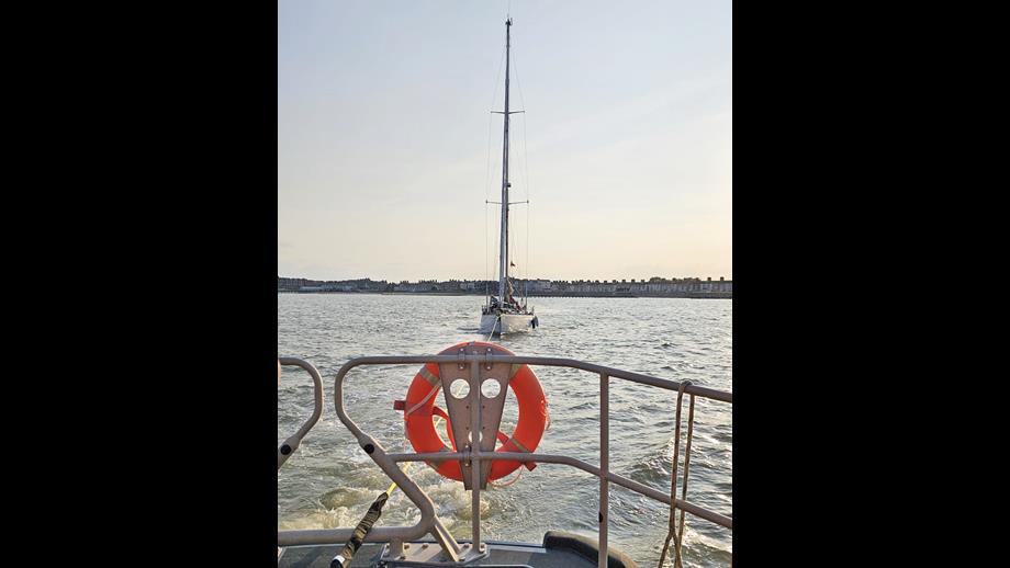 Lowestoft RNLI relief lifeboat towing the stranded yacht with gear box failure