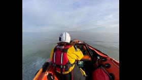 The inshore lifeboat in totally calm seas.